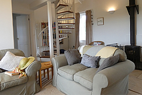 Pippin Cottage - living room with woodburner stove